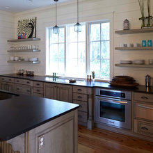 Light Hardwood. Grey Cabinet, Black Countertop