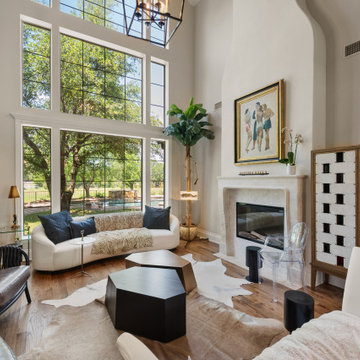Vaulted Great Room with Floor-to-Ceiling Plaster Statement Fireplace