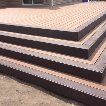 Composite deck with hot tub and pool.
