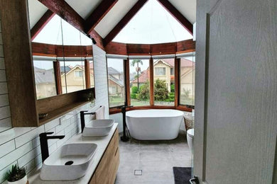 Inspiration for a traditional master bathroom with furniture-like cabinets and a floating vanity.