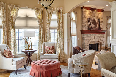 Inspiration for a large timeless formal and open concept medium tone wood floor living room remodel in Chicago with beige walls, a standard fireplace, a stone fireplace and no tv