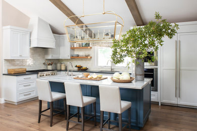 Inspiration for a large transitional u-shaped eat-in kitchen remodel in San Francisco with an island