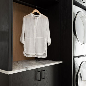 Luxury Tall White Custom Cabinetry in Laundry Room