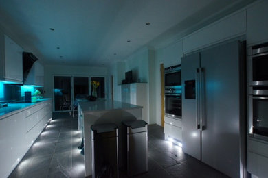 Photo of a large modern galley kitchen in Dorset with with island.