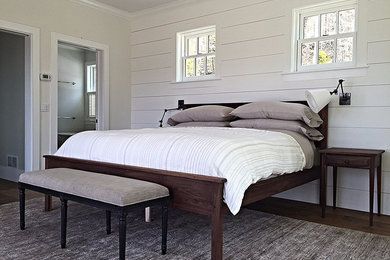 Mid-sized cottage master dark wood floor bedroom photo in Burlington with white walls and a standard fireplace