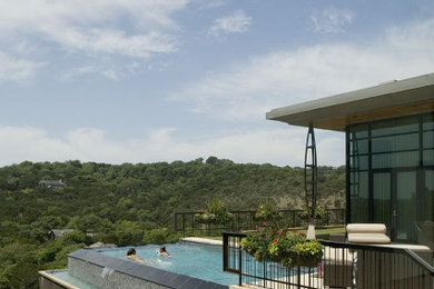 Design ideas for a contemporary rooftop rectangular infinity pool in Austin.
