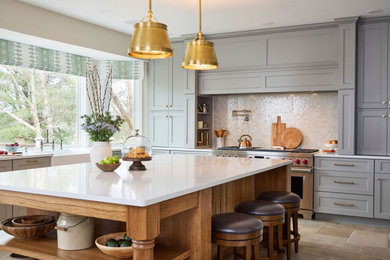 Example of a huge transitional u-shaped cement tile floor kitchen pantry design in DC Metro with a farmhouse sink and an island