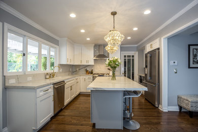 Large minimalist u-shaped medium tone wood floor and brown floor eat-in kitchen photo in Los Angeles with an undermount sink, shaker cabinets, white cabinets, marble countertops, red backsplash, marble backsplash, stainless steel appliances and an island