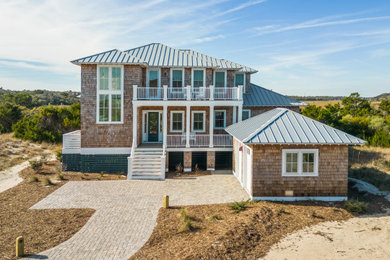 Beach style home design photo in Other