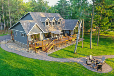 Transitional blue exterior home idea in Minneapolis with a shingle roof