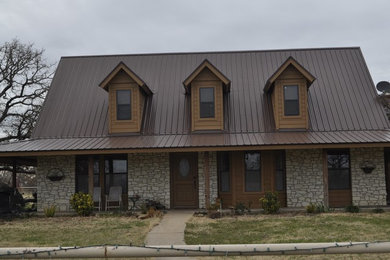 Mid-sized brown two-story mixed siding exterior home idea in Austin