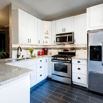 White Kitchen Remodel with Colonial White Granite and Stainless Steel Appliances