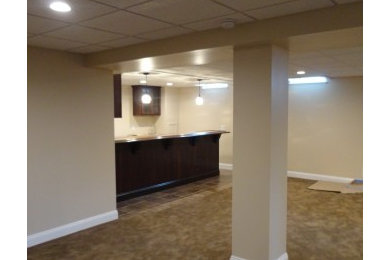 Basement remodel with custom bar.