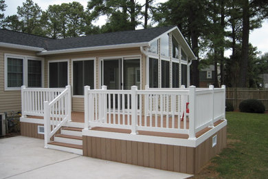 Example of a small classic backyard patio design in Other with no cover and decking