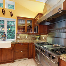 kitchen with yellow wall and stain cabinet