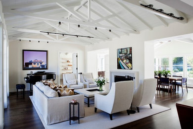 Inspiration for a large transitional open concept living room in San Francisco with a music area, white walls, dark hardwood floors, a standard fireplace, a plaster fireplace surround, no tv and brown floor.