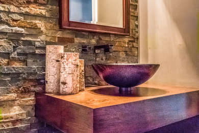 Mid-sized trendy 3/4 stone tile dark wood floor bathroom photo in St Louis with a one-piece toilet, beige walls and a pedestal sink