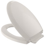 Toto - Toto Guinevere Slow Close Elong Toilet Seat and Lid, Sedona Beige - TOTO Guinevere SoftClose Non Slamming, Slow Close Elongated Toilet Seat and Lid,  is the latest in innovative smart seat technology. Constructed of solid, High-Impact Plastic, this unique seat is specifically designed to reduce injury and to eliminate annoying Toilet Seat Slam. The seat and lid utilize a built-in SoftClose hinge system, which lowers the seat and lid down to the bowl gently and quietly.  This seat is designed to match the TOTO Guinevere toilet, but would also complement other TOTO elongated toilets as well as other brands of elongated toilets.