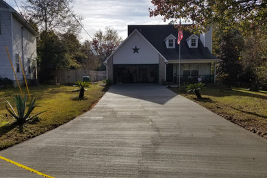 Photo of a large traditional front yard driveway in Jacksonville.