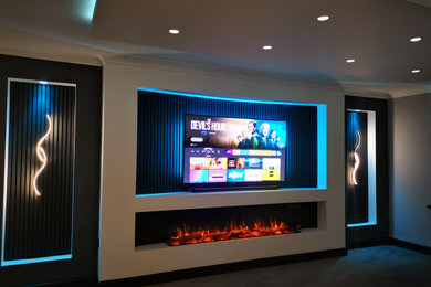 This is an example of a contemporary home cinema in West Midlands.