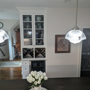 White inset cabinetry with walnut custom accents