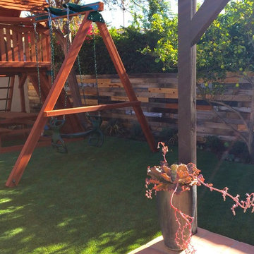 Play Space with generous padding under artificial turf grass