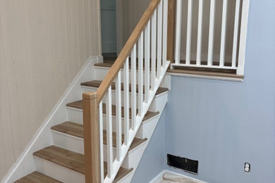 Staircase - small coastal wooden straight wood railing staircase idea in New York with wooden risers