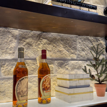 Contemporary Glass Wine Room Featuring a Limestone Wall