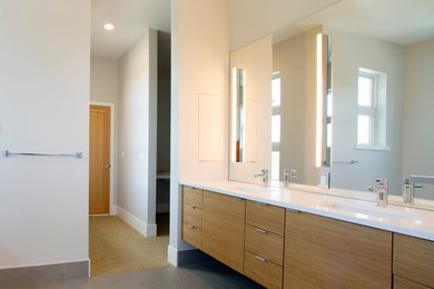 Inspiration for a modern master bathroom remodel in Seattle with flat-panel cabinets and medium tone wood cabinets