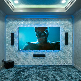 Design ideas for a small contemporary enclosed home cinema in Tampa with grey walls, carpet and a wall mounted tv.