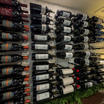 Floor-to-ceiling Glass Panels in Contemporary Wine Room with Metal Wine Racks