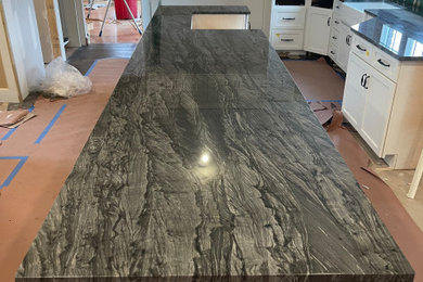 Inspiration for an eat-in kitchen remodel in Chicago with quartzite countertops, an island and gray countertops