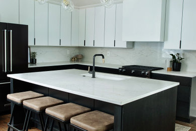 Inspiration for a modern l-shaped medium tone wood floor enclosed kitchen remodel in Cincinnati with a single-bowl sink, flat-panel cabinets, quartzite countertops, white backsplash, stone slab backsplash, black appliances and an island