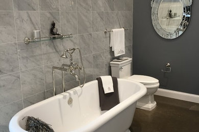 Traditional bathroom in New York with furniture-like cabinets, white cabinets, grey walls and marble benchtops.