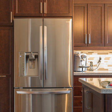 Falsetta - Brown Cabinets with Mosaic Tile Backsplash