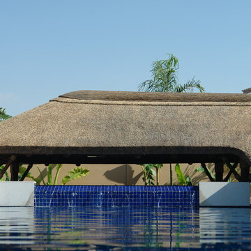 Thatch & timber is the is the focal point of this beautifully landscaped garden
