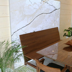 Walnut Dining Bench in front of back-lit stone panel - Products