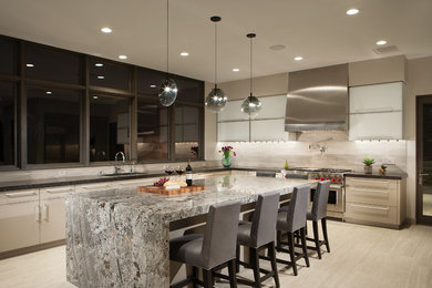 Example of a mid-sized transitional u-shaped porcelain tile and beige floor open concept kitchen design in Phoenix with an undermount sink, flat-panel cabinets, gray cabinets, quartz countertops, beige backsplash, ceramic backsplash, stainless steel appliances, an island and black countertops