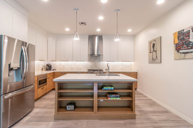 Inspiration for a modern vinyl floor kitchen remodel in Phoenix with an undermount sink, flat-panel cabinets, quartz countertops and an island