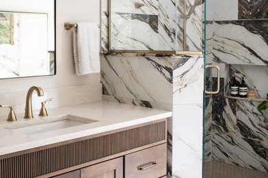 Inspiration for a mid-sized transitional master porcelain tile porcelain tile, beige floor and double-sink corner shower remodel in Other with shaker cabinets, medium tone wood cabinets, white walls, an undermount sink, quartz countertops, a hinged shower door, white countertops, a niche and a built-in vanity