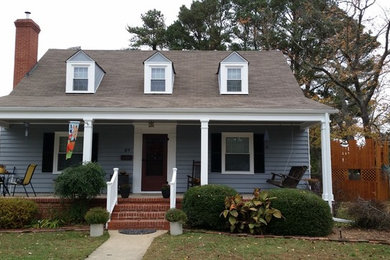 Mid-sized elegant blue one-story wood exterior home photo in Other
