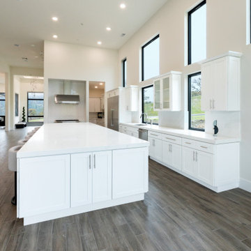 Modern White Shaker Kitchen with Oversized Island & Custom Storage Solutions
