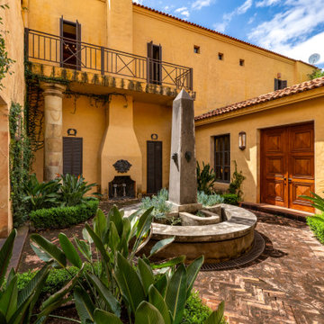 Hacienda Las Tapias - The Italian courtyard with a dry obelisk fountain and an o