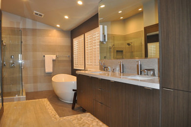 Design ideas for a contemporary master bathroom in Los Angeles with flat-panel cabinets, dark wood cabinets, a freestanding tub, a corner shower, gray tile, porcelain tile, porcelain floors, an undermount sink and engineered quartz benchtops.