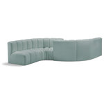 Meridian Furniture - Arc Vegan Leather Upholstered 6-Pc. Facing Modular Sectional, Green - Unleash modern opulence with the Arc Vegan Leather 6pc. Sectional. Crafted for the modern connoisseur, this Sectional injects an air of refined luxury into any space. Its sleek silhouette, upholstered in supple mint green vegan leather, exudes timeless sophistication while the deep channel tufting adds textural intrigue, further elevating the chair's visual appeal. The modular design makes it a versatile chameleon, effortlessly adapting to your evolving needs and preferences. Whether you envision it gracing a chic living room corner, basking in the glow of a bedroom window, or adding a touch of drama to a home office, the Arc seamlessly complements your unique interior aesthetic.