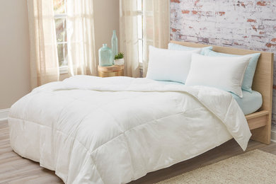 Urban master laminate floor bedroom photo in Cincinnati