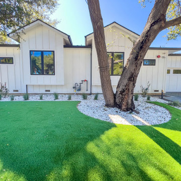 Modern Low-Maintenance Front Yard with Custom Fence and Artificial Turf