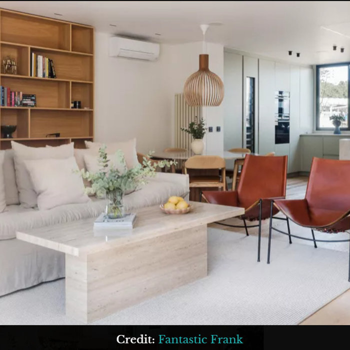 Living Room with room-within-a-room feel by laying out your seating area to completely face away from the dining area