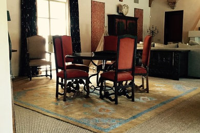 Example of a mid-sized ornate carpeted great room design in Houston with white walls and no fireplace