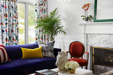 Inspiration for a transitional wainscoting living room remodel in Chicago with white walls, a standard fireplace and a stone fireplace